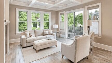 Living room in home that has been staged with white furniture.