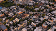 Aerial view of a neighborhood in New York, where home owners may be interested in utilizing the services of a house buying company.