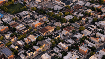 Aerial view of a neighborhood in New York, where home owners may be interested in utilizing the services of a house buying company.