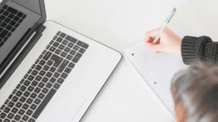 A woman making a checklist for selling the house