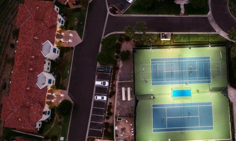 Aerial view of planned unit development (PUD) home pickleball courts