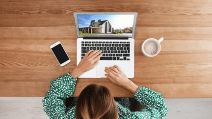 A person using a computer to use Offerpad and Opendoor.