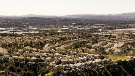 An aerial view of a city in California where houses are bought by We Buy Houses companies.