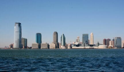 An image of the New Jersey skyline that represents how an owner might sell to cash home buyers in Jersey City