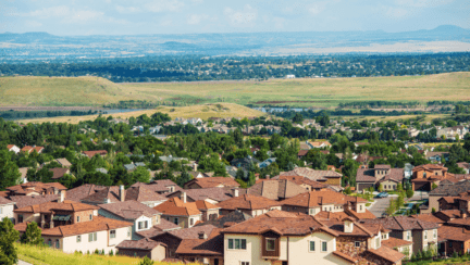 An aerial view of a town to represent selling a house in Colorado