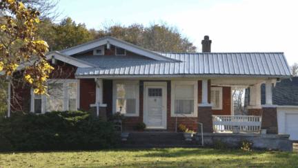 A photo of a Michigan home listed for a cash sale