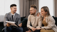 A home buying couple asking mortgage questions to an expert