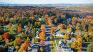 Aerial view of a neighborhood in Milford, where homeowners can work with a we buy houses company