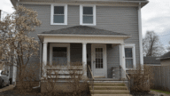 gray two story house bought from owner