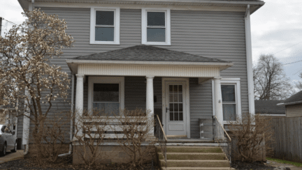 gray two story house bought from owner
